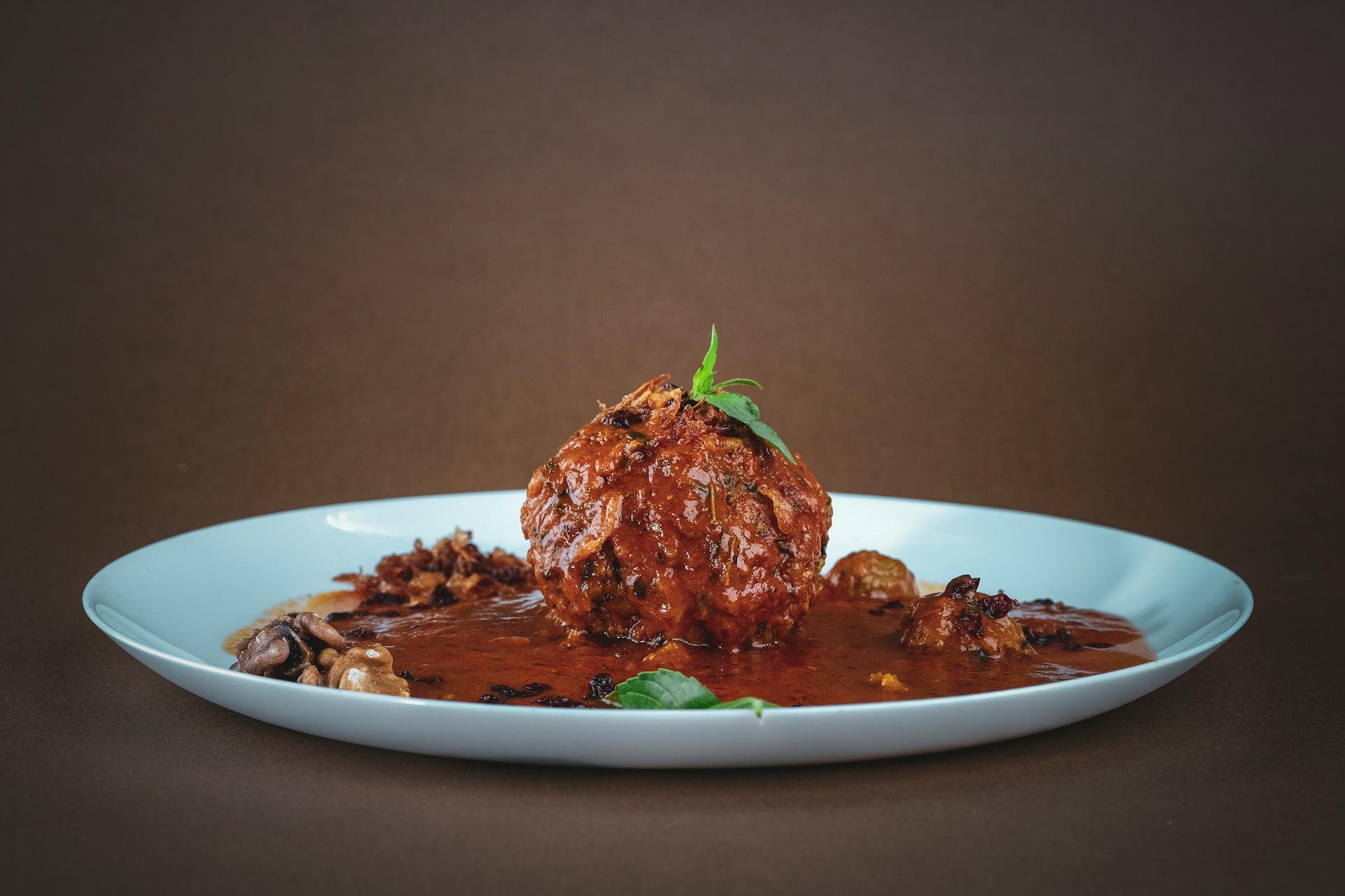 cooked meat on white ceramic plate